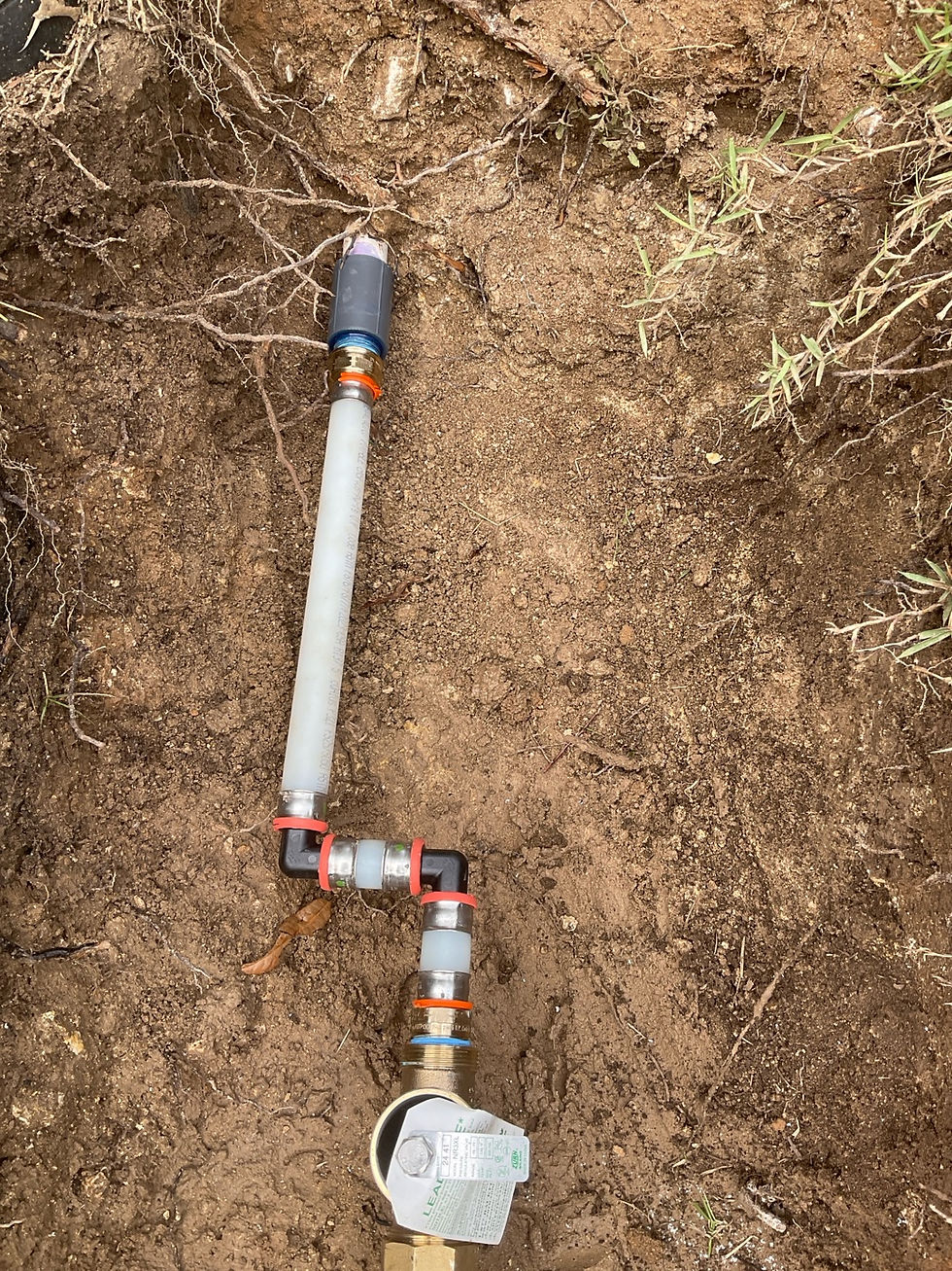 Newly installed 1-inch pressure regulator valve with PEX pipe and fittings in San Antonio, TX by Rapid Plumbing