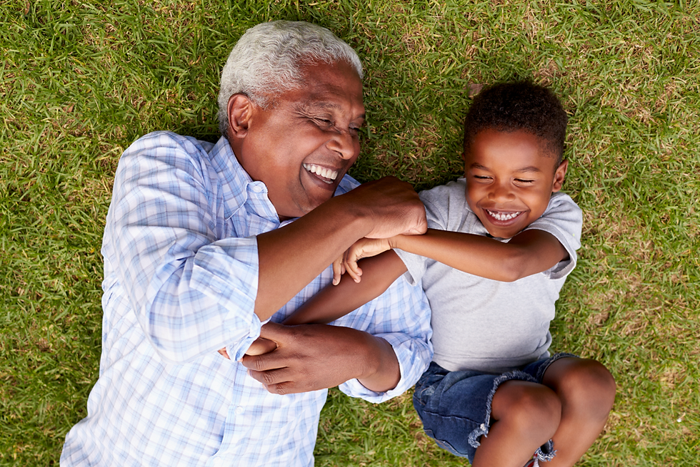 Grandfather playing with grandchild. Protect and preserve your legacy through estate planning.