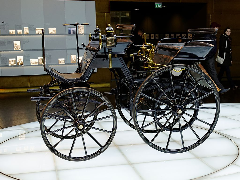 This Daimler Motorized Carriage, built in 1886, was the first automobile produced by Gottlieb Daimler and Wilhelm Maybach, marking a pivotal moment in automotive history.