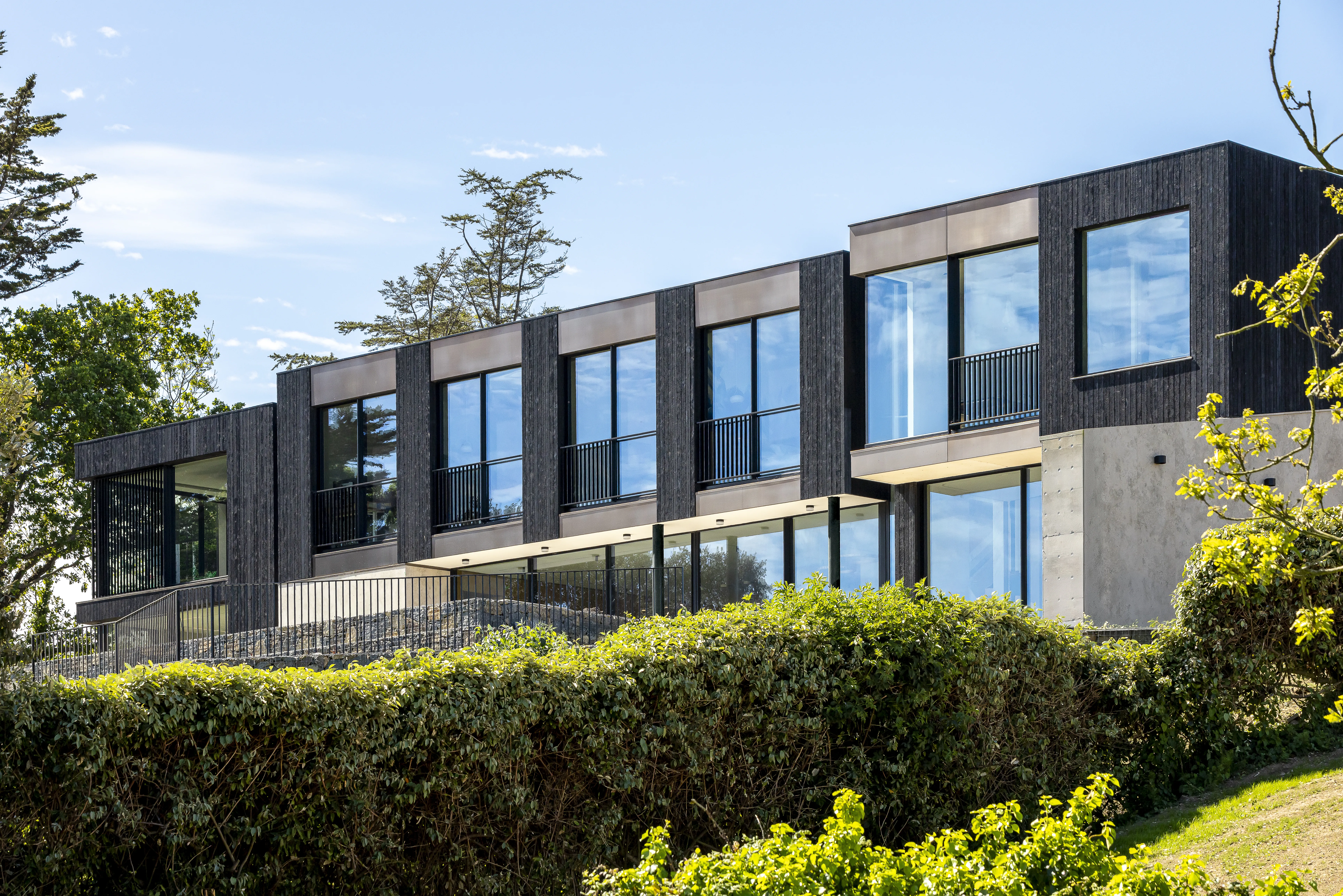 DLM Architects — An image showcasing a completed residential or commercial project by DLM, featuring the building’s exterior or interior design and architectural detai