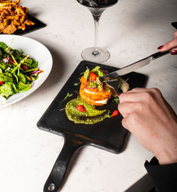 Fried onions cut with knife at Solana Great Room in Westlake, Texas