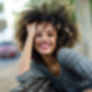 Smiling Woman with Curly Hair