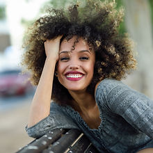 Smiling Woman with Curly Hair