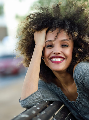 Smiling Woman with Curly Hair