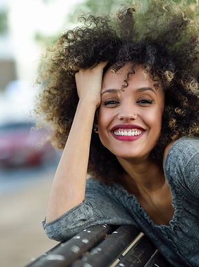 Smiling Woman with Curly Hair