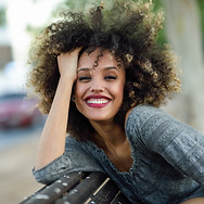 Smiling Woman with Curly Hair