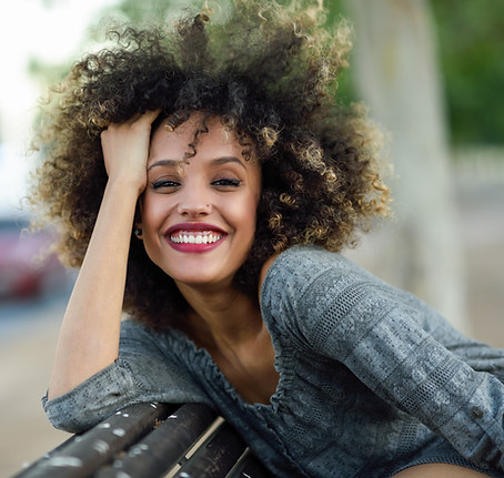Smiling Woman with Curly Hair