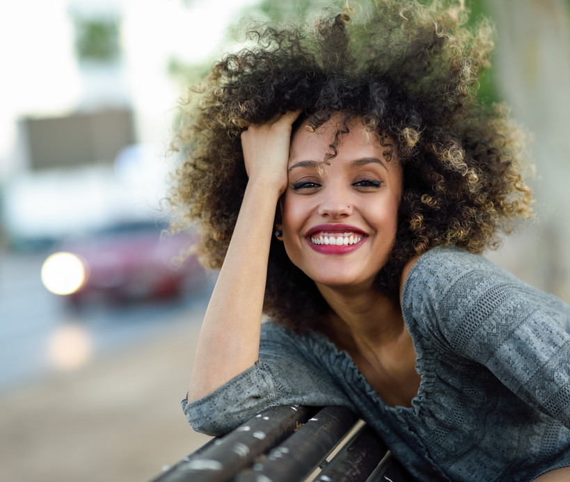 Smiling Woman with Curly Hair