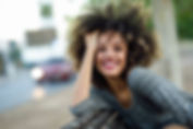 Smiling Woman with Curly Hair