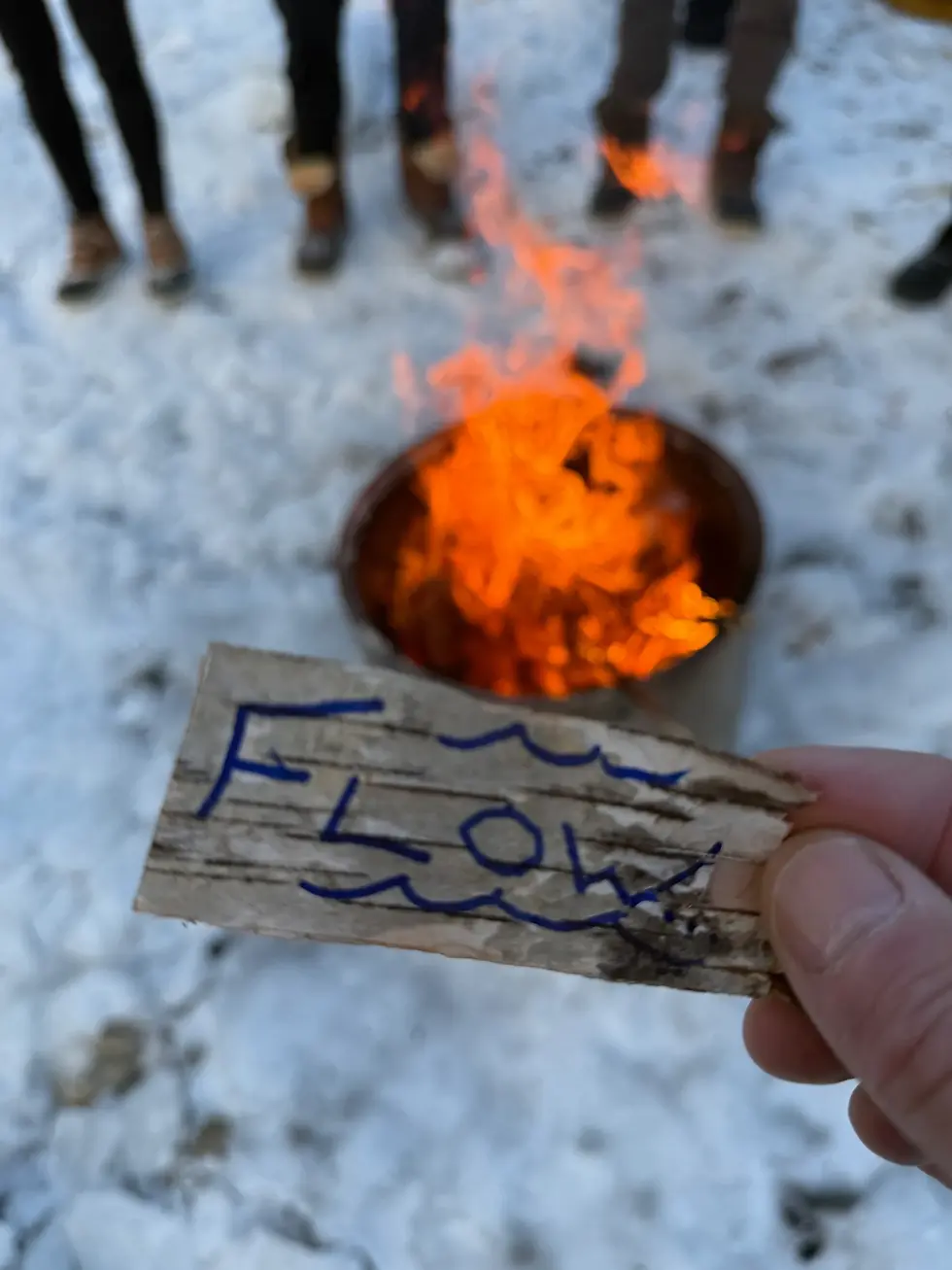 fire pit with a note reading "flow"