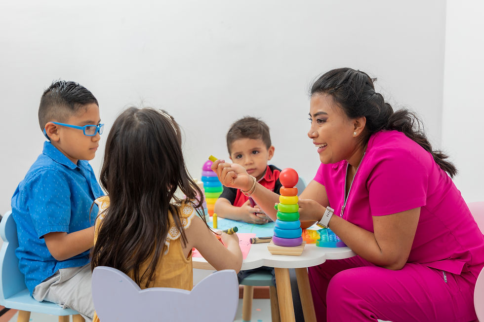 female-pediatrician-sitting-table-with-several-children-playing-her-medical-office.jpg