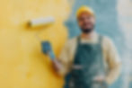 professional-painter-painting-wall-with-paint-roller.jpg