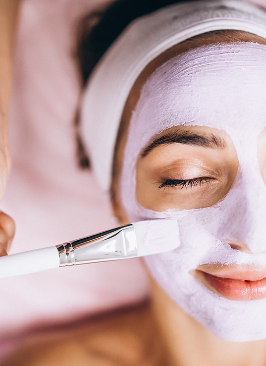 cosmetologist-applying-mask-face-client-beauty-salon.jpg