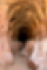 Entrance into a tunnel carved out of the red rocks