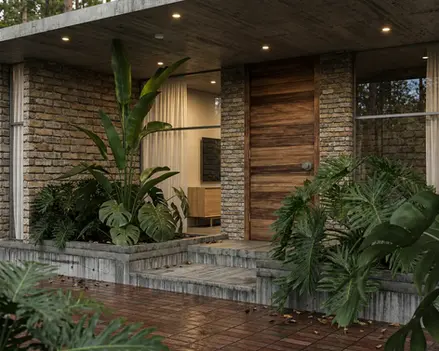 Acceso a zona privada de casa campestre enmarcado por vegetación nativa y diseño paisajístico