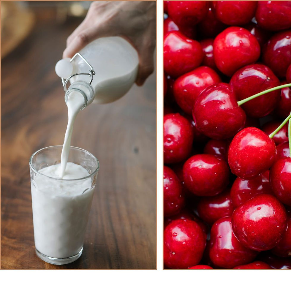 Eine Hand, die aus einer Flasche Milch eingießt und viele Kirschen