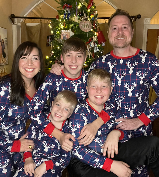 Family photo in Christmas pajamas.