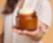 Woman holds jar of whipped tallow skincare; for dry skin, Watch Me Glow.