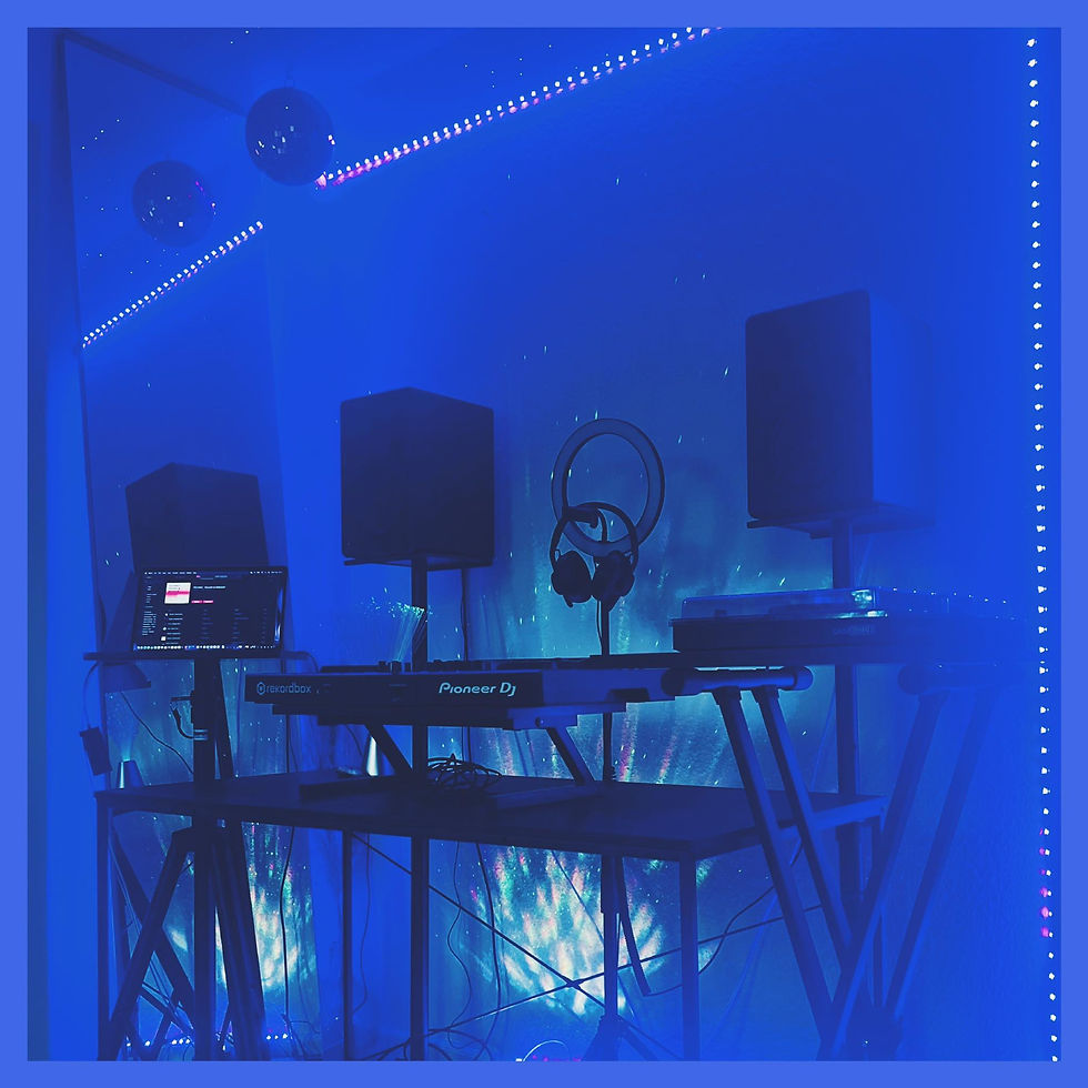 Close-up view of DJ equipment with colorful lights in a dark room