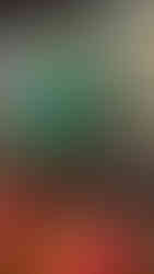 Mixed media wall installation at CCCADI East Harlem featuring coiled blue and green tubing erupting from a black canvas decorated with gold geometric lines, shattered mirror fragments, and colorful textile collage