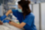 Nurse in blue scrubs providing care to a patient—representing future Native American leaders in healthcare through OSU’s Nursing Leadership Program.
