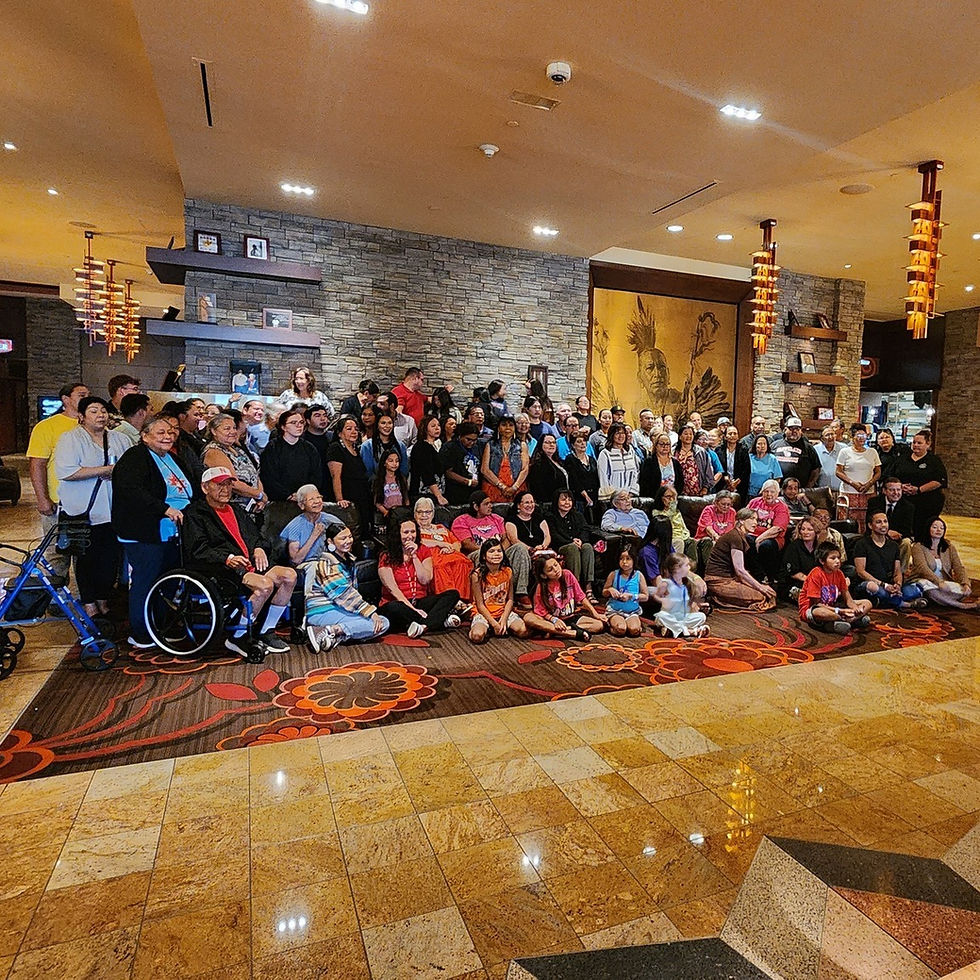 Group photo of attendees at the 2025 Dhegiha Language Conference, held at Downstream Casino Resort. Participants include elders, youth, and tribal leaders from multiple Dhegiha-speaking nations.
