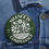 Thumbnail: Social justice button reading ‘Silence Is Compliance’ pinned to dark denim jacket pocket, showcasing activist flair.