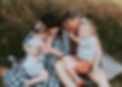 A family hugging and laughing in a portrait