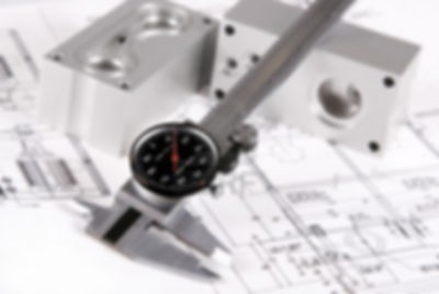 1412885-caliper-over-blur-engineering-drawing-and-blocks.jpg