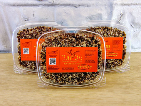 deli containers of vegan suet with an orange label