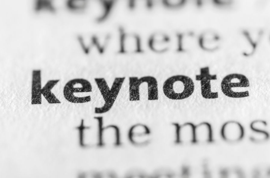 Close-up of the word "keynote" emphasized in bold text on a printed page. Black and white, with blurred surrounding text.