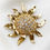 Thumbnail: Yves Saint Laurent zonnebloem broche door Robert Goossens