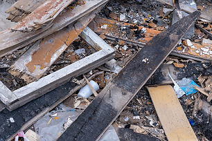 garbage-background-from-old-burnt-wooden-boards-bricks-plastic-garbage-after-destruction-h