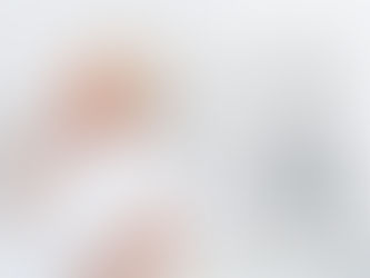 Woman yawning in bed in the background with an alarm clock in the foreground.