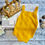 Thumbnail: Mustard Sleeveless Knit Pom-Pom Romper - Unisex