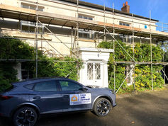 Little Jobs Cornwall branded car in front of a building