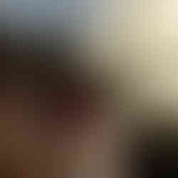 A person, taking a photo of Wheal Coates