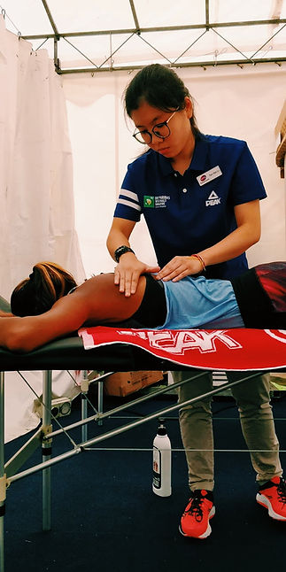 therapist working on patient during event