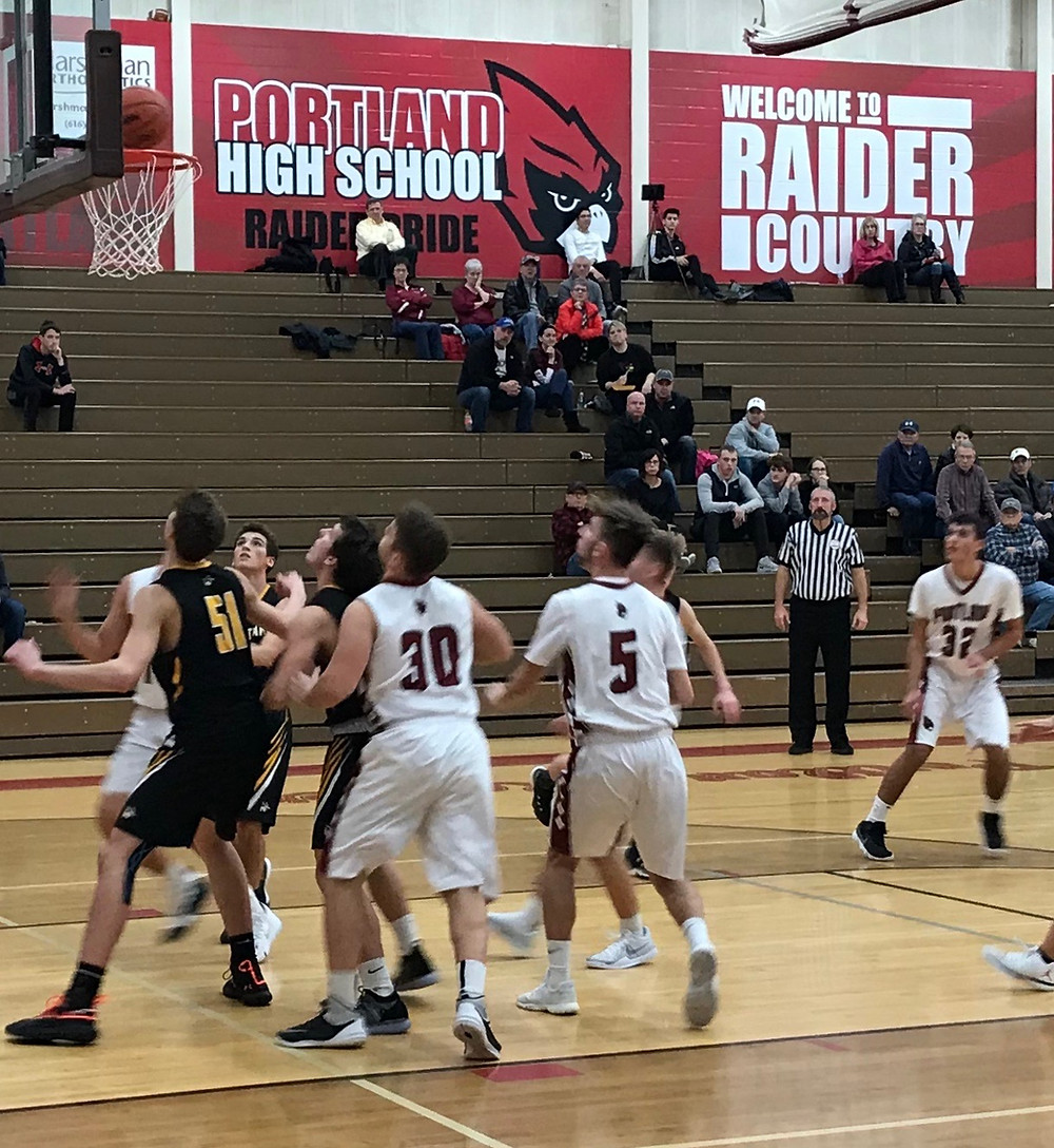 Aryan Virk connects for two of his game high 17 points against Lansing Christian.