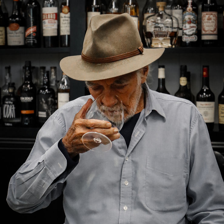 Gabriel Chaise is nosing a glass of Armagnac in the Cerbaco office. Photography: Emily Sampson