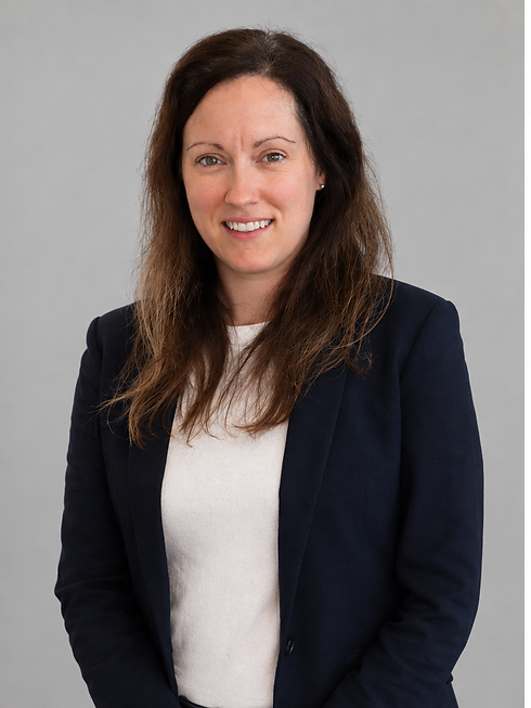 professional_portrait_standing_grey_background(1).png