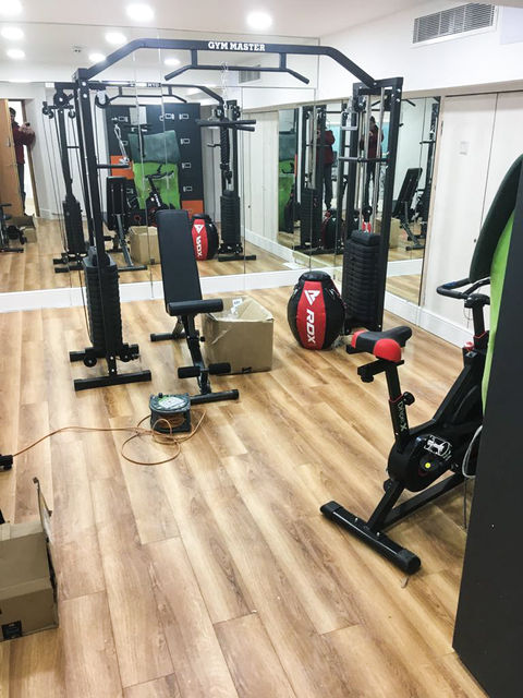 Fully equipped office gym space, featuring modern fitness equipment and a motivating environment.