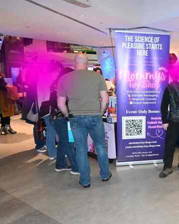 Guests exploring beginner-friendly adult toys at Edmonton science event