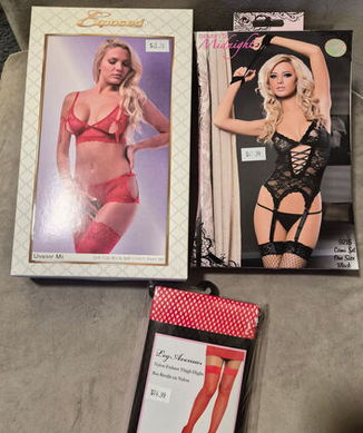 A charity auction prize bundle donated by Mommys Toy Shop in Edmonton, showcasing a curated selection of lingerie and red fishnet thigh-high stockings chosen by the auction winner as part of a local community fundraising effort.