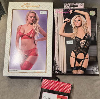 A charity auction prize bundle donated by Mommys Toy Shop in Edmonton, showcasing a curated selection of lingerie and red fishnet thigh-high stockings chosen by the auction winner as part of a local community fundraising effort.