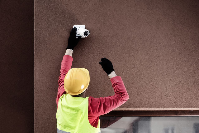 IP mini bullet camera being installed onto a wall