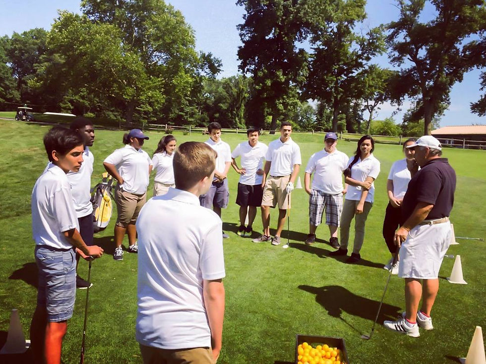 SCIP Interns learning how to play golf at the golf academy