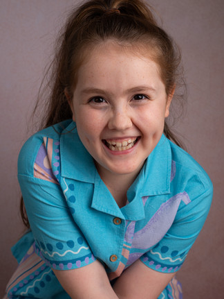 smiling young girl having headshots in Tonbridge studio