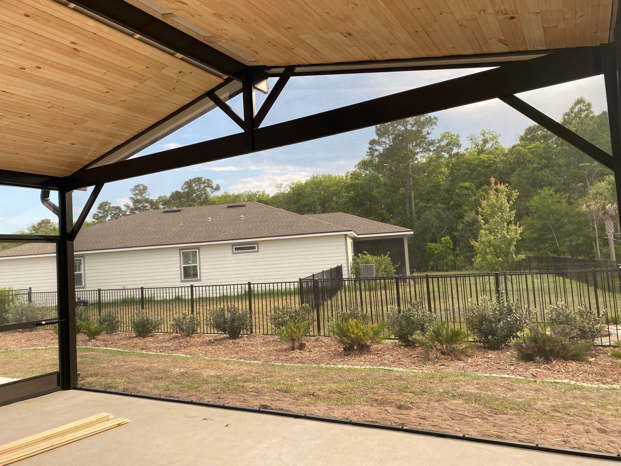Panoramic view screen combined with peaked composite roof with tongue-and-groove paneling