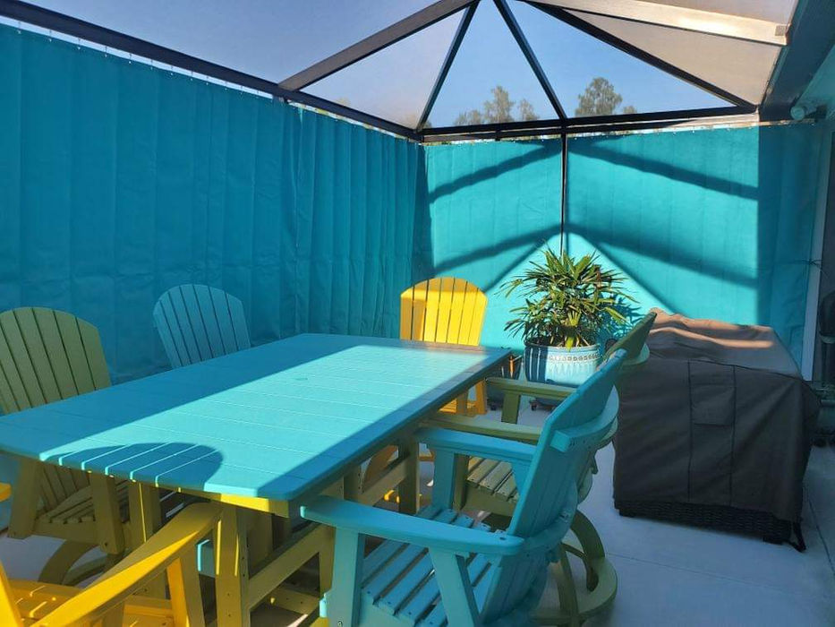 Brightly colored privacy curtains attached to a screen enclosure are pulled to give complete privacy to a residential patio